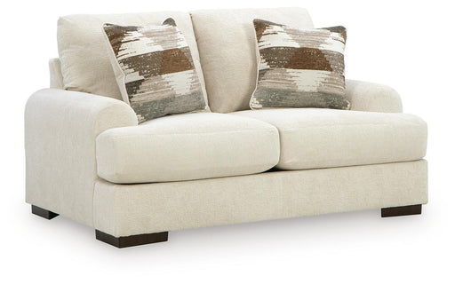 Ashley Furniture Jayne Park loveseat shown from an angle, featuring plush fabric upholstery and modern design.