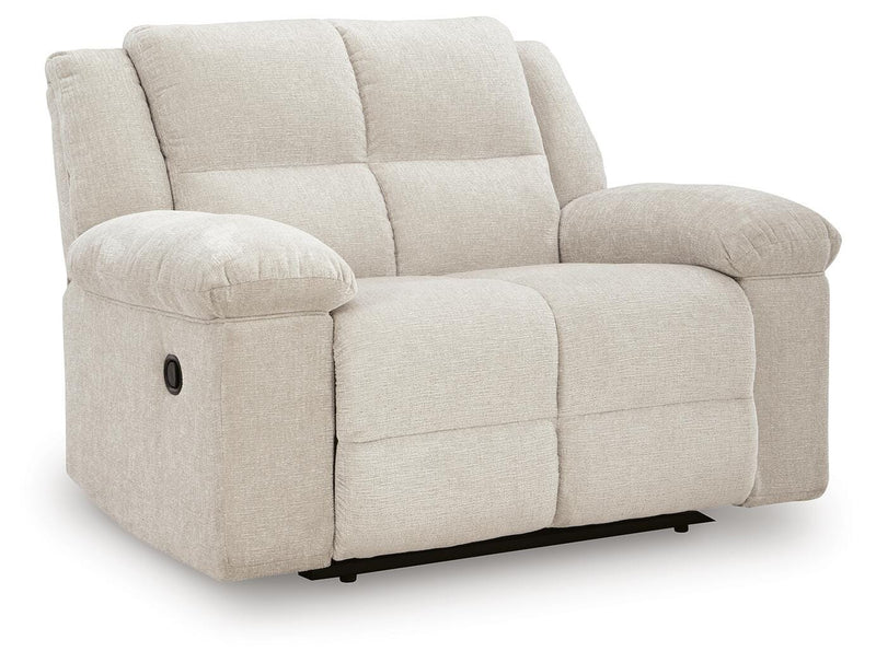 Ashley Furniture Orlen oversized recliner in brown fabric, shown from an angled view with closed footrest.
