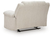 Ashley Furniture Orlen oversized recliner with plush backrest and padded armrests, shown from the back in a cozy living room setting.