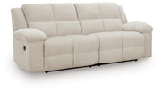 Ashley Furniture Orlen reclining sofa with plush cushions and modern design, viewed from an angle showing the open recline feature.