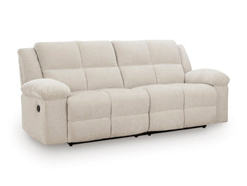 Ashley Furniture Orlen reclining sofa in a close-up side angle showing plush cushions and reclining mechanism.