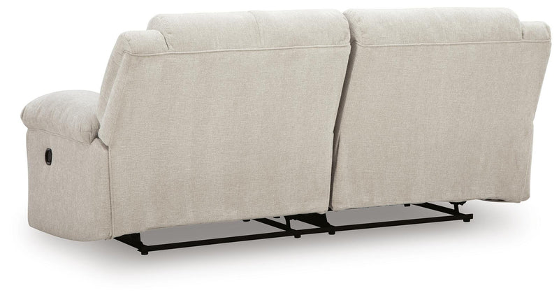 Ashley Furniture Orlen reclining sofa with plush cushions and fabric upholstery, shown from the back view.