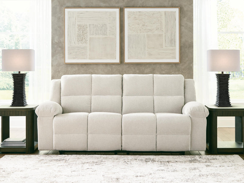 Ashley Furniture Orlen reclining sofa with plush cushions and dark upholstery, shown in a close-up view.