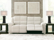 Ashley Furniture Orlen reclining sofa with plush cushions and wide armrests, shown in an open position for relaxed seating.