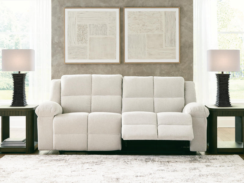 Ashley Furniture Orlen reclining sofa with plush cushions and wide armrests, shown in an open position for relaxed seating.
