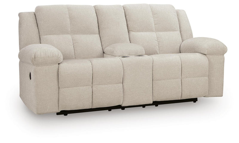 Ashley Furniture Orlen reclining loveseat with built-in console, shown from an angled side view featuring plush cushions and dark upholstery.