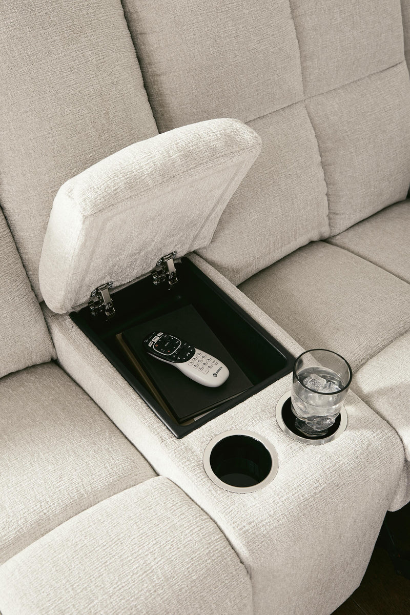 Ashley Furniture Orlen reclining loveseat with console, featuring plush fabric, padded armrests, and integrated cup holders.
