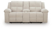 Ashley Furniture Orlen reclining loveseat with console, shown in a head-on view, featuring plush upholstery and built-in cup holders.