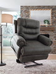 Ashley Furniture power lift recliner in plush fabric, showing the side angle with footrest extended and back reclined.