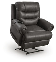 Ashley Furniture power lift recliner in beige fabric, showing the reclined position with armrests and control panel visible.