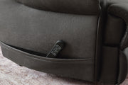 Ashley Furniture power lift recliner with plush cushioning and detailed pocket stitching, designed for comfort and support.