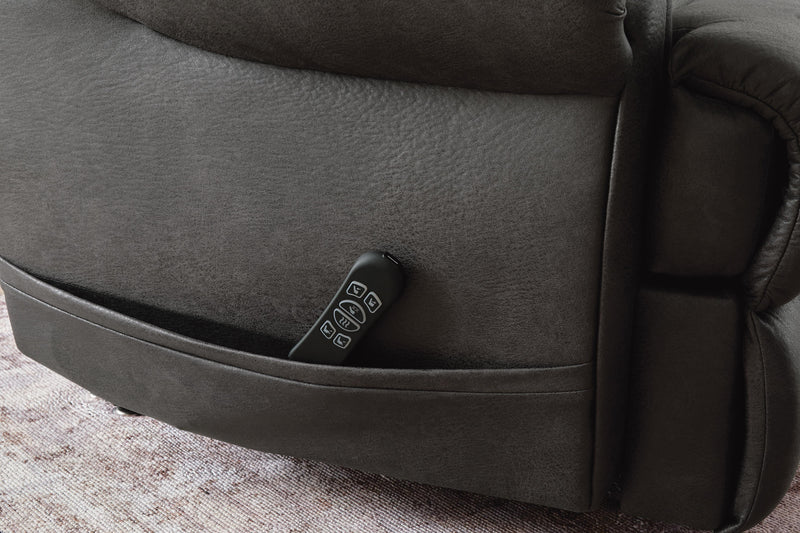 Ashley Furniture power lift recliner with plush cushioning and detailed pocket stitching, designed for comfort and support.