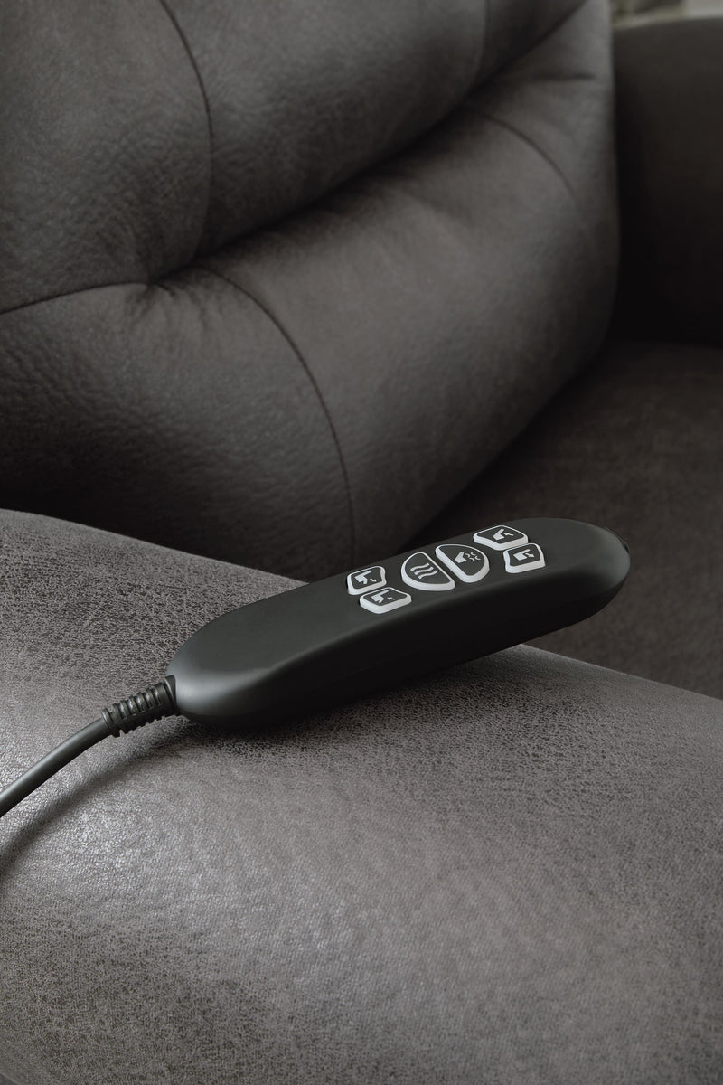 Ashley Furniture power lift recliner in dark leather, showing plush cushioning and adjustable reclining features.