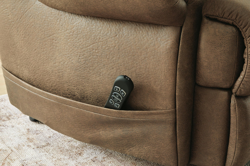 Ashley Furniture power lift recliner with plush upholstery and pocketed back cushions, designed for comfort and easy reclining.