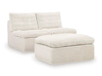 Ashley Furniture Fannin armless sectional chair with matching ottoman, modern design, beige fabric, and sleek styling.