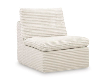 Ashley Furniture Fannin Armless Chair sectional in neutral upholstery, shown at an angle highlighting its modern design and clean lines.
