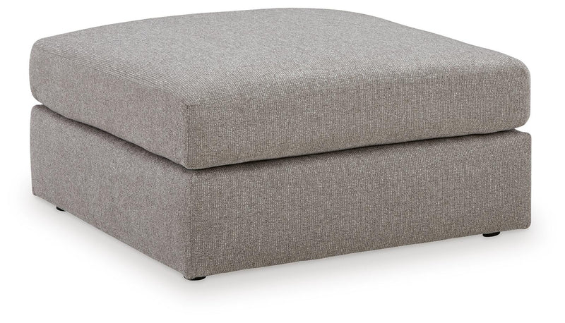 Ashley Furniture Lindon oversized accent Ottoman with plush fabric and a modern design, shown from an angled side view.