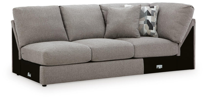 Ashley Furniture Lindon sectional with chaise, featuring plush upholstery and modern design, shown from an angled side view.