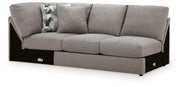 Ashley Furniture Lindon sectional with chaise, beige fabric, featuring plush cushions and modern design in an angled view.