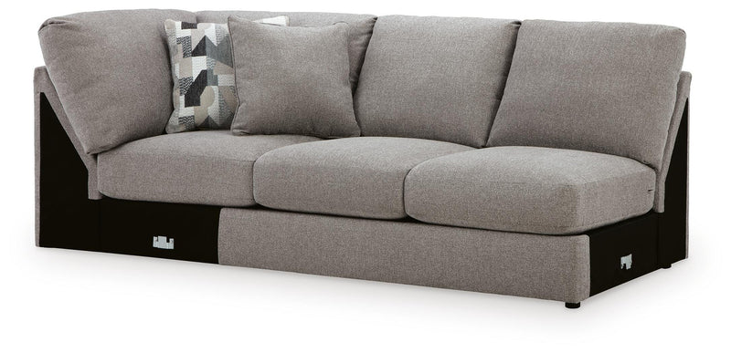 Ashley Furniture Lindon sectional with chaise, beige fabric, featuring plush cushions and modern design in an angled view.