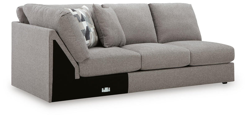 Ashley Furniture Lindon sectional with chaise, showing a modern fabric sofa with cushions and a spacious design in an angled view.