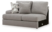Ashley Furniture Lindon sectional with chaise, showing a modern upholstered living room sofa with cushions and a chaise lounge in an angle view.