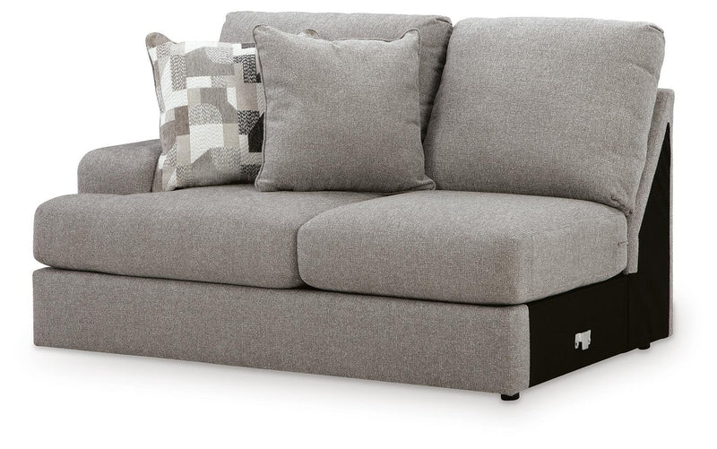 Ashley Furniture Lindon sectional with chaise, showing a modern upholstered living room sofa with cushions and a chaise lounge in an angle view.