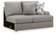 Ashley Furniture Lindon sectional with chaise, showing a modern fabric sofa with multiple cushions and a chaise lounge in a living room.