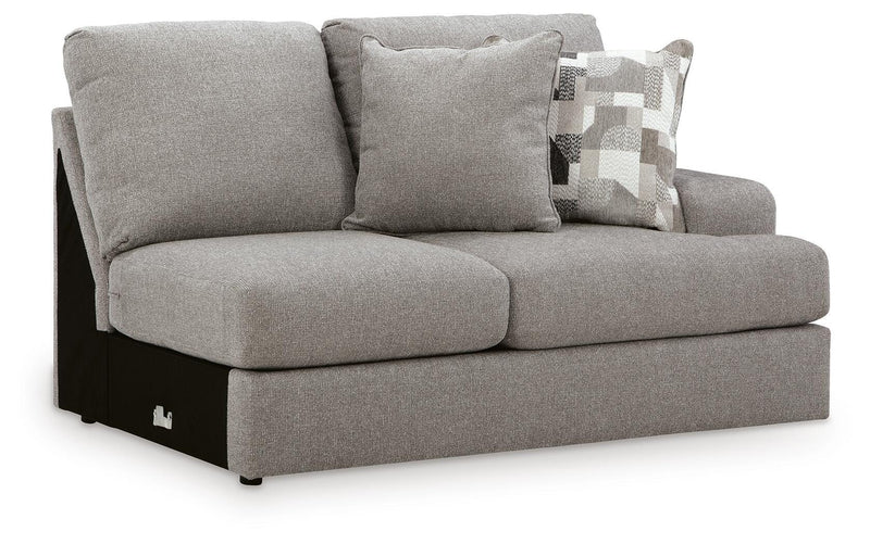 Ashley Furniture Lindon sectional with chaise, showing a modern fabric sofa with multiple cushions and a chaise lounge in a living room.