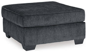 Ashley Furniture Altari oversized accent ottoman with plush fabric, angled design, and sturdy wood legs.