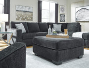 Ashley Furniture Altari oversized accent ottoman with plush fabric and tufted top, perfect for living room decor.