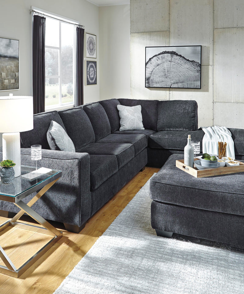 Ashley Furniture Altari living room set with sofa and armchair, featuring neutral upholstery and modern design.