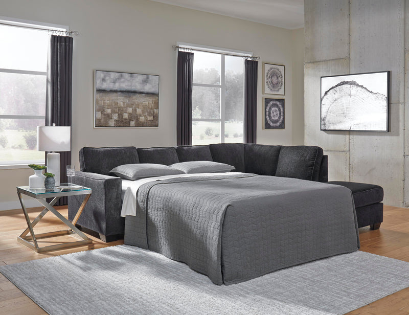 Ashley Furniture Altari Living Room Set featuring a plush sofa, loveseat, and matching armchair with neutral upholstery.