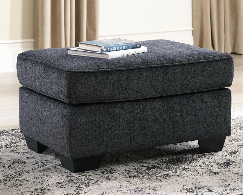 Ashley Furniture Altari Ottoman with cushioned top and wooden legs, beige fabric upholstery, and compact rectangular design.
