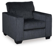 Ashley Furniture Altari Chair with plush beige upholstery and wooden legs, showcasing a cozy and stylish living room seating option.