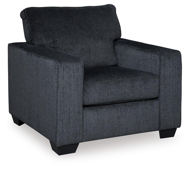 Ashley Furniture Altari living room set with beige fabric sofa and matching armchair in a modern home interior.