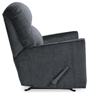 Ashley Furniture Altari recliner with plush upholstery and padded armrests, shown from the side in a cozy living room setting.