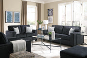 Ashley Furniture Altari sofa sleeper with plush fabric, shown in a stylish living room setting, featuring a convertible design for guest sleeping.