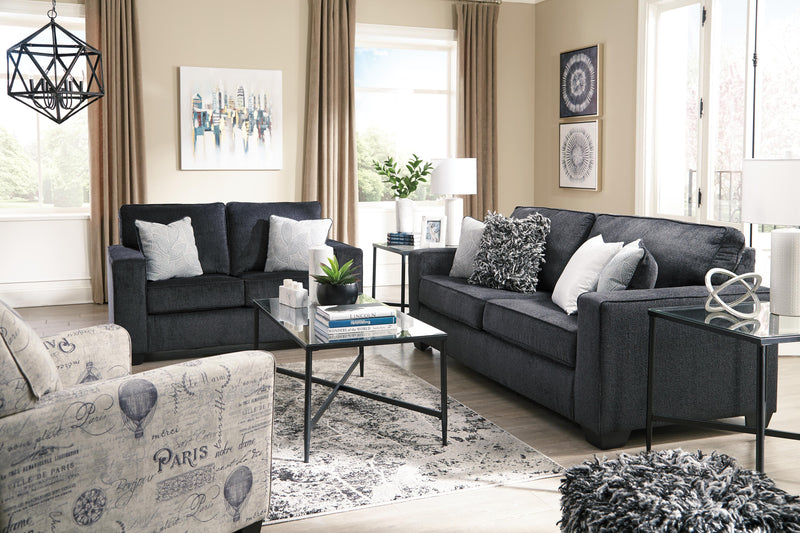 Ashley Furniture Altari sleeper sofa with beige upholstery and plush cushions, shown in a contemporary living room setting.