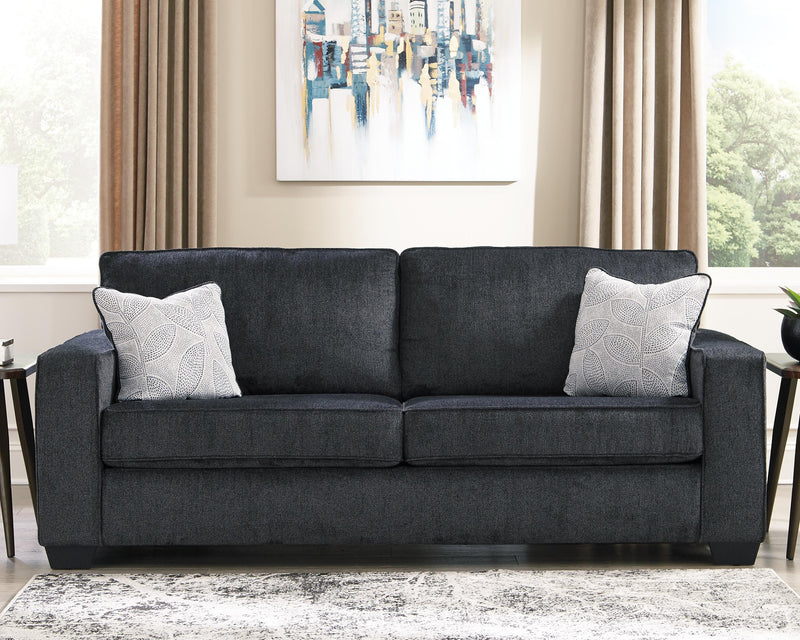 Ashley Furniture Altari living room set with sofa, love seat, and armchair in neutral upholstery, arranged in a cozy modern design.