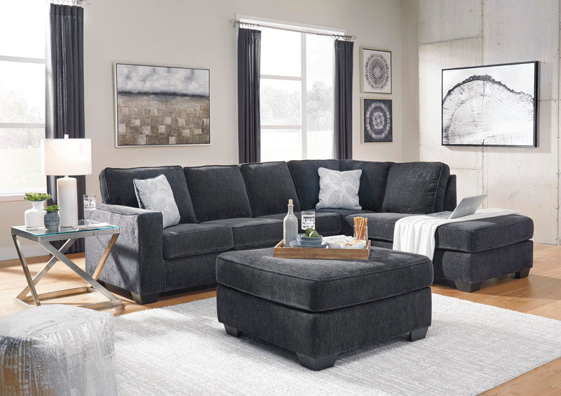 Ashley Furniture Altari sectional with chaise, tan fabric, modern design, featuring plush cushions and a spacious seating arrangement.