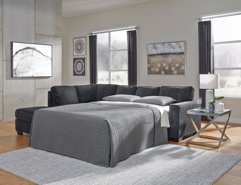 Ashley Furniture Altari Living Room Set with sofa and armchair featuring beige upholstery and modern design.