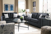 Ashley Furniture Altari loveseat with plush beige upholstery and cushioned armrests, perfect for cozy living room seating.