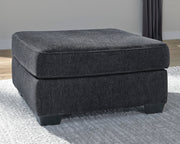 Ashley Furniture Altari oversized accent ottoman with plush fabric and modern design, shown in a cropped view.