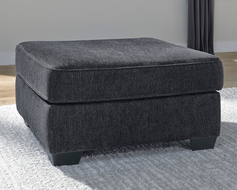 Ashley Furniture Altari oversized accent ottoman with plush fabric and modern design, shown in a cropped view.