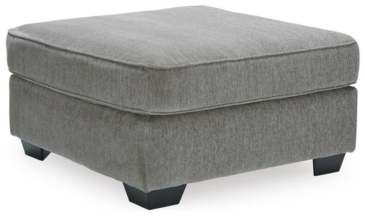 Ashley Furniture Altari oversized accent ottoman with plush fabric and angled design, shown from a side view.