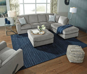 Ashley Furniture Altari oversized accent ottoman with plush fabric and modern design, used as a versatile living room accent piece.