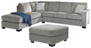 Ashley Furniture Altari living room set with sofa, loveseat, and coffee table arranged in a modern, stylish living space.