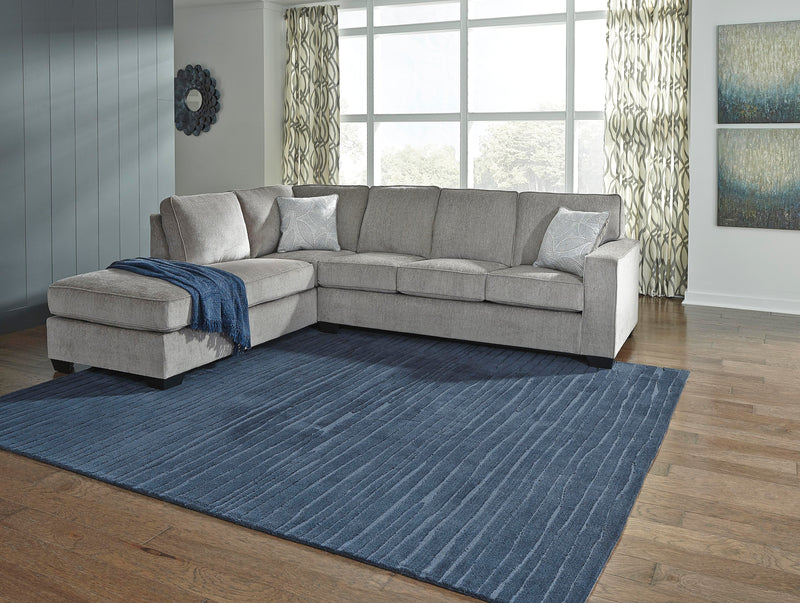 Ashley Furniture Altari living room set with sectional sofa, armchair, and coffee table in a modern design.