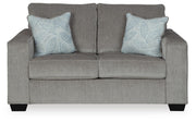 Ashley Furniture Altari living room set featuring a sofa and armchair with plush cushions and neutral upholstery.